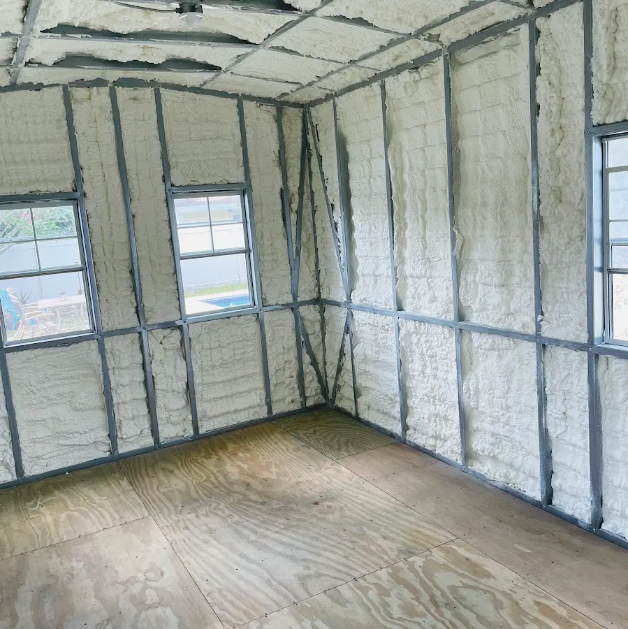 Closed-cell spray foam insulation applied to wall cavities in a residential project in Pass Christian